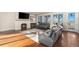 Cozy living room with fireplace, recessed lighting and great outdoor view at 7172 S Oakleaf St, Bennett, CO 80102