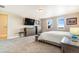Spacious main bedroom with carpeting, large windows, and a light color scheme at 7172 S Oakleaf St, Bennett, CO 80102