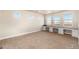 Spacious office with built-in desks and plenty of natural light from the multiple windows at 7172 S Oakleaf St, Bennett, CO 80102