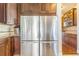 Stainless steel refrigerator with built-in cabinetry, offering both style and functionality in the kitchen at 7172 S Oakleaf St, Bennett, CO 80102