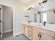 Modern bathroom featuring a double vanity, quartz countertop, contemporary lighting, and gray tile flooring at 2329 Lakeshore Ln # 14, Superior, CO 80027