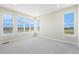 Bright bedroom showcasing scenic views through large windows, carpeted floor, and neutral wall color at 2329 Lakeshore Ln # 14, Superior, CO 80027