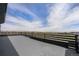 Large wooden deck overlooking a landscaped neighborhood at 2329 Lakeshore Ln # 14, Superior, CO 80027