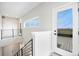 Hallway featuring a modern staircase and large sliding door to a deck providing scenic views of the area at 2329 Lakeshore Ln # 14, Superior, CO 80027