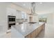 Bright, open kitchen with large island, stainless steel appliances, and ample natural light at 2329 Lakeshore Ln # 14, Superior, CO 80027