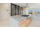 Kitchen island featuring stone countertops, custom cabinets and stainless steel appliances at 2329 Lakeshore Ln # 14, Superior, CO 80027