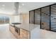 Modern kitchen island with custom cabinets, stainless appliances and stone countertops at 2329 Lakeshore Ln # 14, Superior, CO 80027