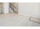 Living room featuring light wood floors, stairs, and a modern interior design at 2329 Lakeshore Ln # 14, Superior, CO 80027