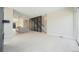 Open-concept living room with light wood floors and view into the modern kitchen and stairs at 2329 Lakeshore Ln # 14, Superior, CO 80027