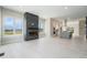 Open-concept living room featuring a modern fireplace, large windows, and access to the kitchen at 2329 Lakeshore Ln # 14, Superior, CO 80027