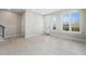 Bright living room with white walls, light wood floors, and abundant natural light from large windows at 2329 Lakeshore Ln # 14, Superior, CO 80027
