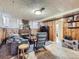 Relaxing basement with wood paneling, a cozy fireplace, and comfortable seating at 2330 W 46Th Ave, Denver, CO 80211