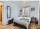 Bright bedroom featuring hardwood floors, neutral decor, and generous natural light at 2330 W 46Th Ave, Denver, CO 80211