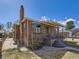 Charming brick home with covered porch, bay window, chimney and landscaped front yard at 2330 W 46Th Ave, Denver, CO 80211