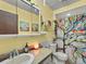 Charming bathroom with a vanity sink, colorful shower curtain, and tasteful decor at 24170 Matterhorn Dr, Indian Hills, CO 80454