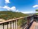 Deck with mountain view and blue sky background at 24170 Matterhorn Dr, Indian Hills, CO 80454