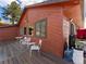 Exterior view of deck with outdoor seating at wood sided home at 24170 Matterhorn Dr, Indian Hills, CO 80454