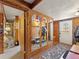 Inviting foyer with mirrored storage, wood paneling, and unique design elements at 24170 Matterhorn Dr, Indian Hills, CO 80454
