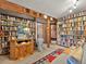 Cozy library with floor-to-ceiling bookshelves and a decorative elephant statue at 24170 Matterhorn Dr, Indian Hills, CO 80454