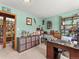 Inviting home office with storage and a view into a large library at 24170 Matterhorn Dr, Indian Hills, CO 80454