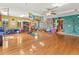 Spacious yoga studio with hardwood floors, featuring yoga equipment, serene ambiance, and ample natural light at 24170 Matterhorn Dr, Indian Hills, CO 80454