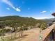 Scenic mountain view from the property, showcasing lush green hills at 24170 Matterhorn Dr, Indian Hills, CO 80454