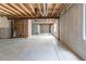 Unfinished basement with concrete walls and exposed ceiling at 4428 S Kalispell Cir, Aurora, CO 80015