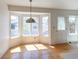 Dining area features beautiful hardwood floors and a bright bay window at 4428 S Kalispell Cir, Aurora, CO 80015