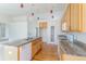Well-designed kitchen with wood floors and granite countertops at 4428 S Kalispell Cir, Aurora, CO 80015