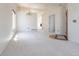 Open Living Room with neutral carpet flows into other rooms at 4428 S Kalispell Cir, Aurora, CO 80015