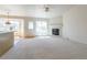 Spacious living room with fireplace, hardwood floor transition and ample natural light at 4428 S Kalispell Cir, Aurora, CO 80015