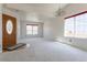 Bright, open living room with plush carpeting and natural light streaming through large windows at 4428 S Kalispell Cir, Aurora, CO 80015