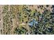 Aerial view of a home with a forest, river, and mountains in the distance at 189 Ginger Quill Ln, Breckenridge, CO 80424