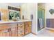 Bathroom featuring double sink vanity, granite counters, and walk-in shower at 189 Ginger Quill Ln, Breckenridge, CO 80424