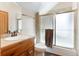 Bathroom featuring a vanity with a tile countertop, a toilet, and a shower with sliding glass doors at 189 Ginger Quill Ln, Breckenridge, CO 80424