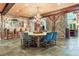 Dining room with wooden table, antler chandelier, and stone column at 189 Ginger Quill Ln, Breckenridge, CO 80424