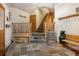 Inviting foyer with slate floors, wooden accents, and a staircase, showcasing a blend of rustic charm and functionality at 189 Ginger Quill Ln, Breckenridge, CO 80424