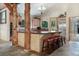 A modern kitchen with an island, granite countertops, and stainless steel appliances at 189 Ginger Quill Ln, Breckenridge, CO 80424