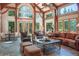 Spacious living room with plenty of seating, large windows, and natural wood accents at 189 Ginger Quill Ln, Breckenridge, CO 80424