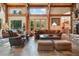 Cozy living room with large windows that offer amazing views of the surrounding forest at 189 Ginger Quill Ln, Breckenridge, CO 80424