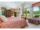 Bright main bedroom with vaulted ceilings, large windows with forest views, and a private balcony at 189 Ginger Quill Ln, Breckenridge, CO 80424