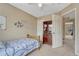 This bedroom features unique wall art, and seamless access to adjacent living spaces at 21789 Farmingdale Way, Parker, CO 80138