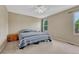 Spacious bedroom featuring carpet floors, a ceiling fan, and two sun-filled windows at 21789 Farmingdale Way, Parker, CO 80138