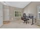 Bright office space with neutral walls, large window, and functional workspace at 21789 Farmingdale Way, Parker, CO 80138