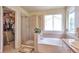Well-lit bathroom featuring a separate glass-enclosed shower, soaking tub, and walk-in closet at 18852 E Progress Ave, Centennial, CO 80015