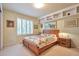 Charming bedroom with natural light, built-in shelves, and ample space for relaxation and comfort at 18852 E Progress Ave, Centennial, CO 80015