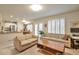 Inviting living room features neutral tones, cozy couches, and access to a charming outdoor space at 18852 E Progress Ave, Centennial, CO 80015