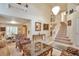 Grand living room featuring a vaulted ceiling, elegant staircase, and open layout with an abundance of natural light at 18852 E Progress Ave, Centennial, CO 80015