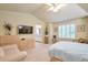 Bright main bedroom with vaulted ceiling, calming colors, large windows, and attached bathroom at 18852 E Progress Ave, Centennial, CO 80015