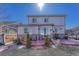 Backyard featuring a patio with a grill and a firepit, a lawn area, and the home's rear exterior at 13903 Hillsboro Dr, Parker, CO 80134